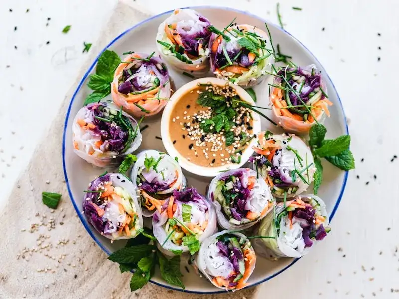 Plated Peruvian ceviche with corn, sweet potato, and red onion, garnished with cilantro