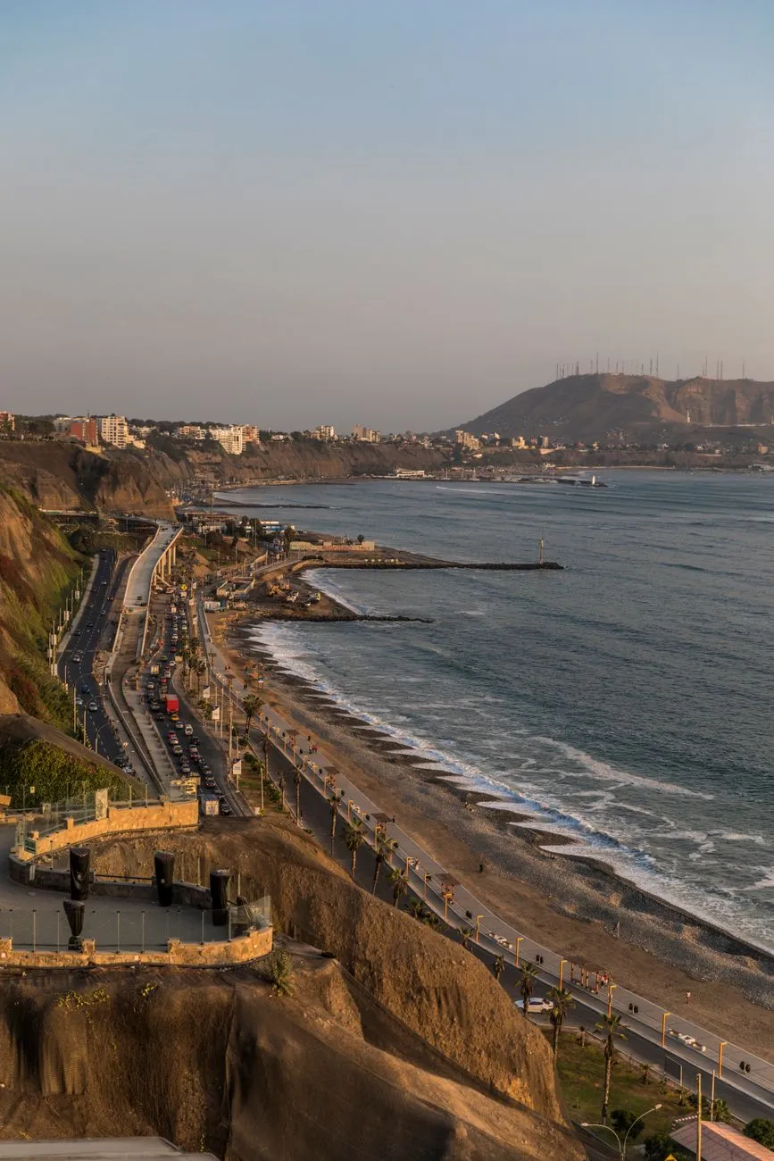 Sun‑kissed Peruvian coastline with fishing boats
