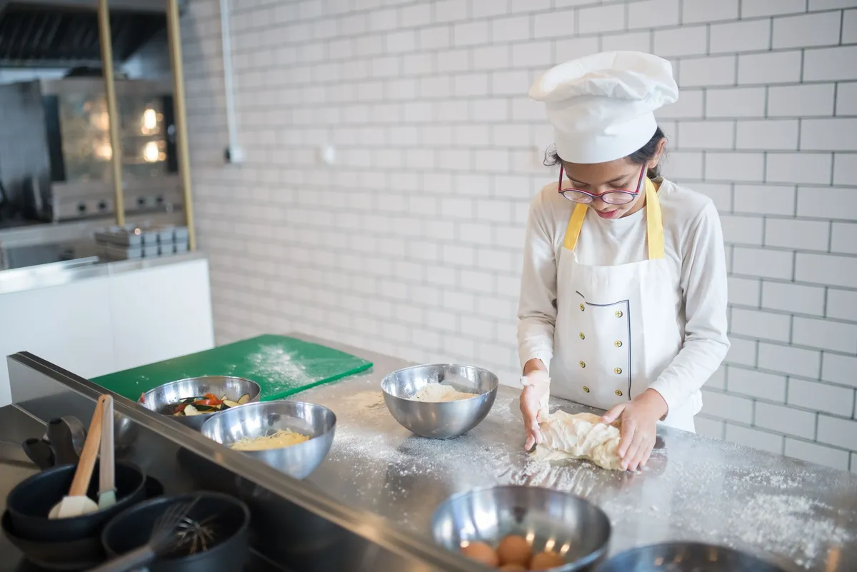 Cooking class hands making pasta