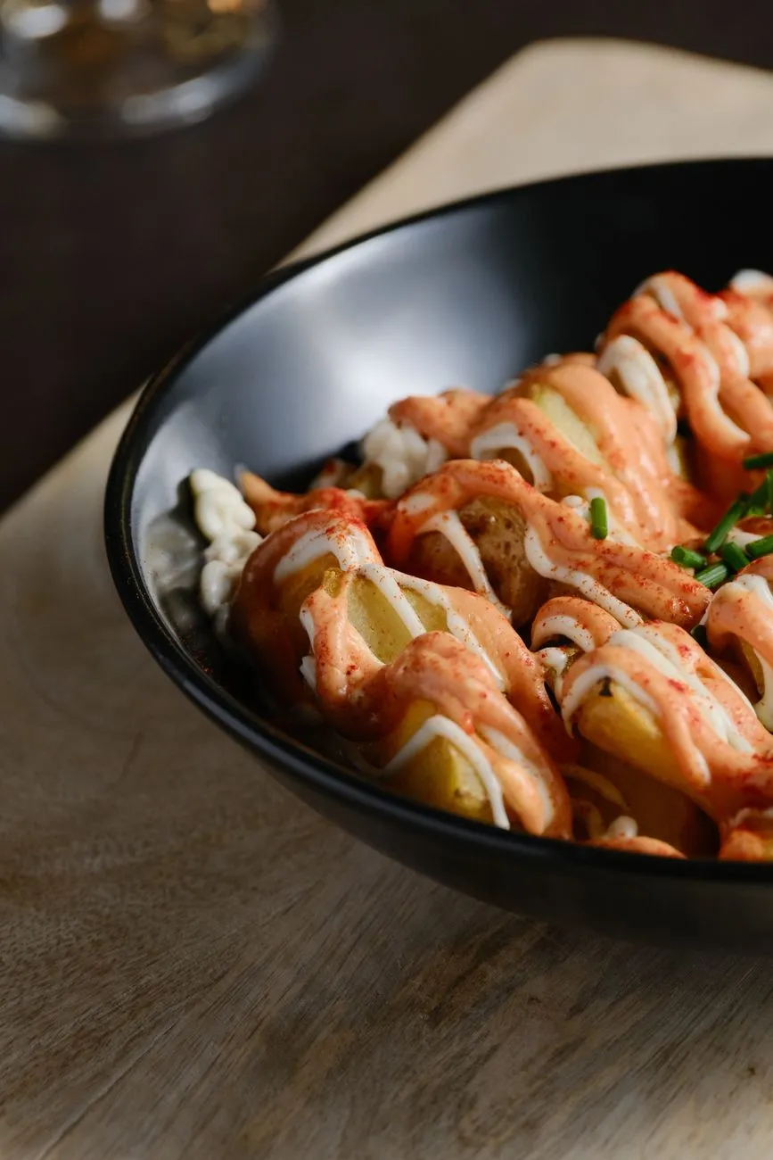 Authentic patatas bravas served in a classic Spanish bar