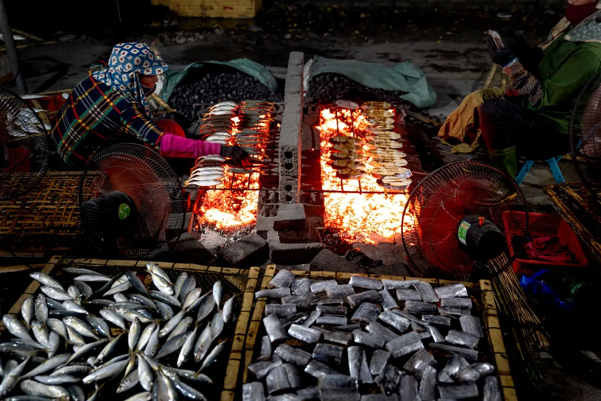 Colorful Senegalese market stall with grilled fish and sauces