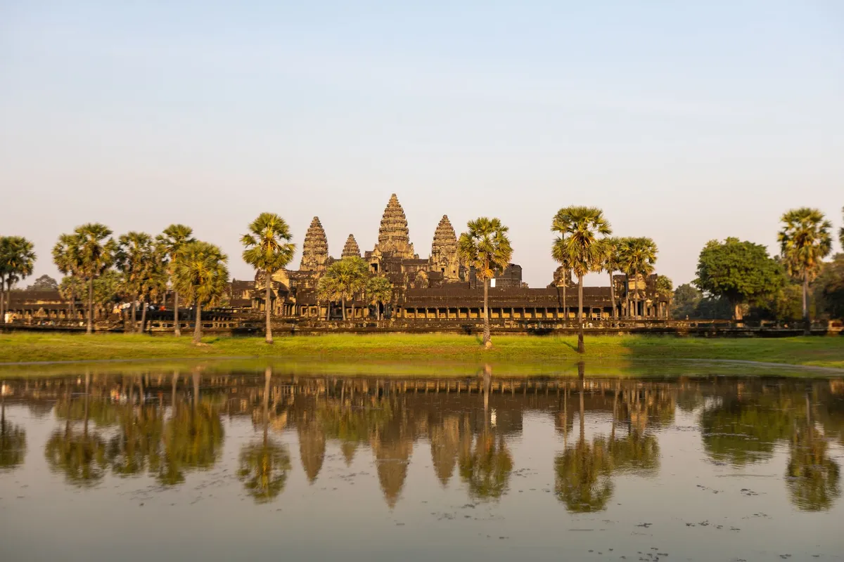Sunrise over Angkor Wat reflecting in the lotus moat