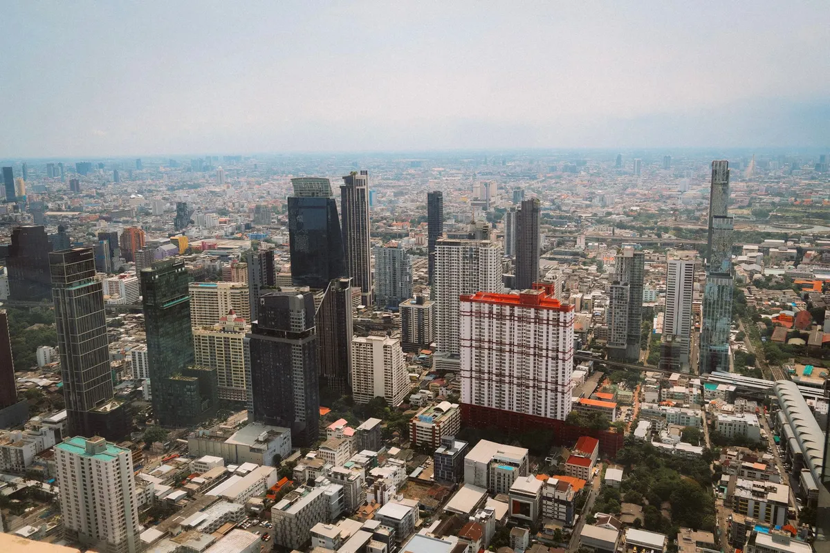 Bangkok skyline at dusk with rooftop bars