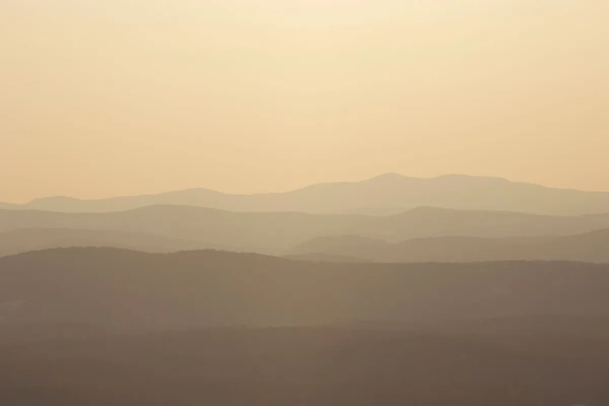 Dawn over a mountain village with a steaming bowl
