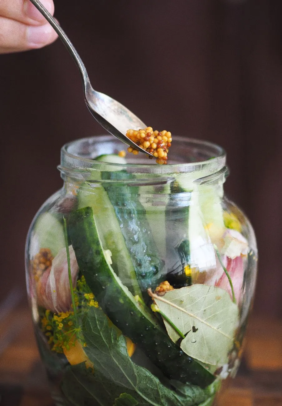 Variety of pickled vegetables in jars