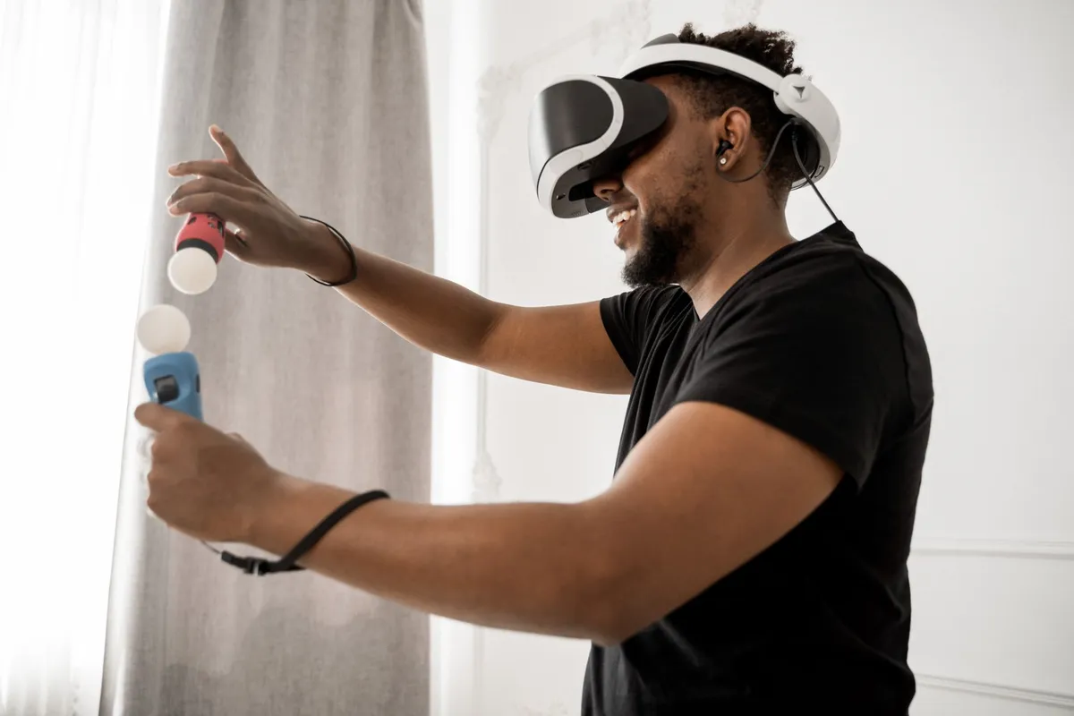 A digital artist working in a VR environment with AI-generated 3D models floating around them