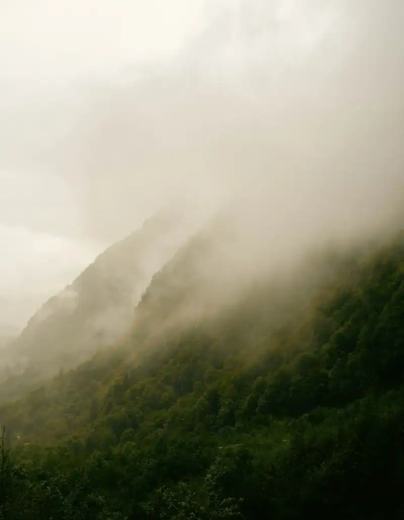 A misty mountain range at dawn