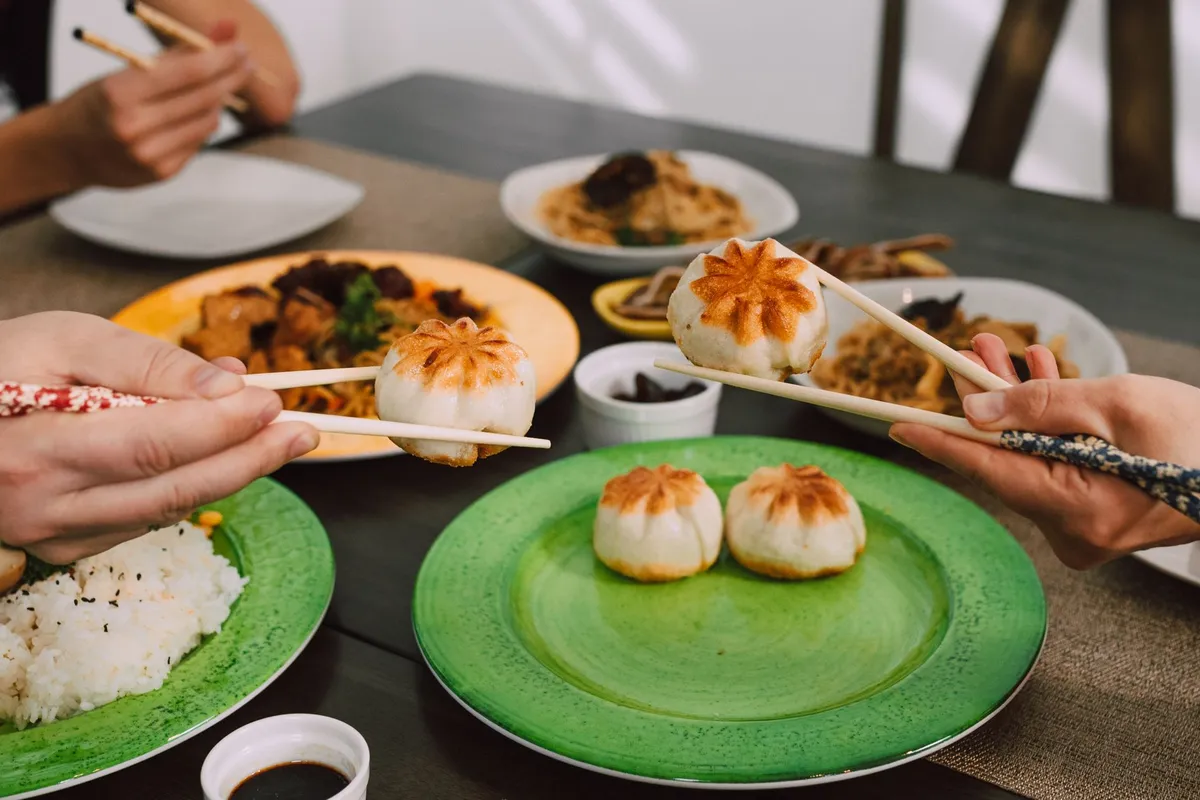 A colorful spread of dim sum dishes on a table