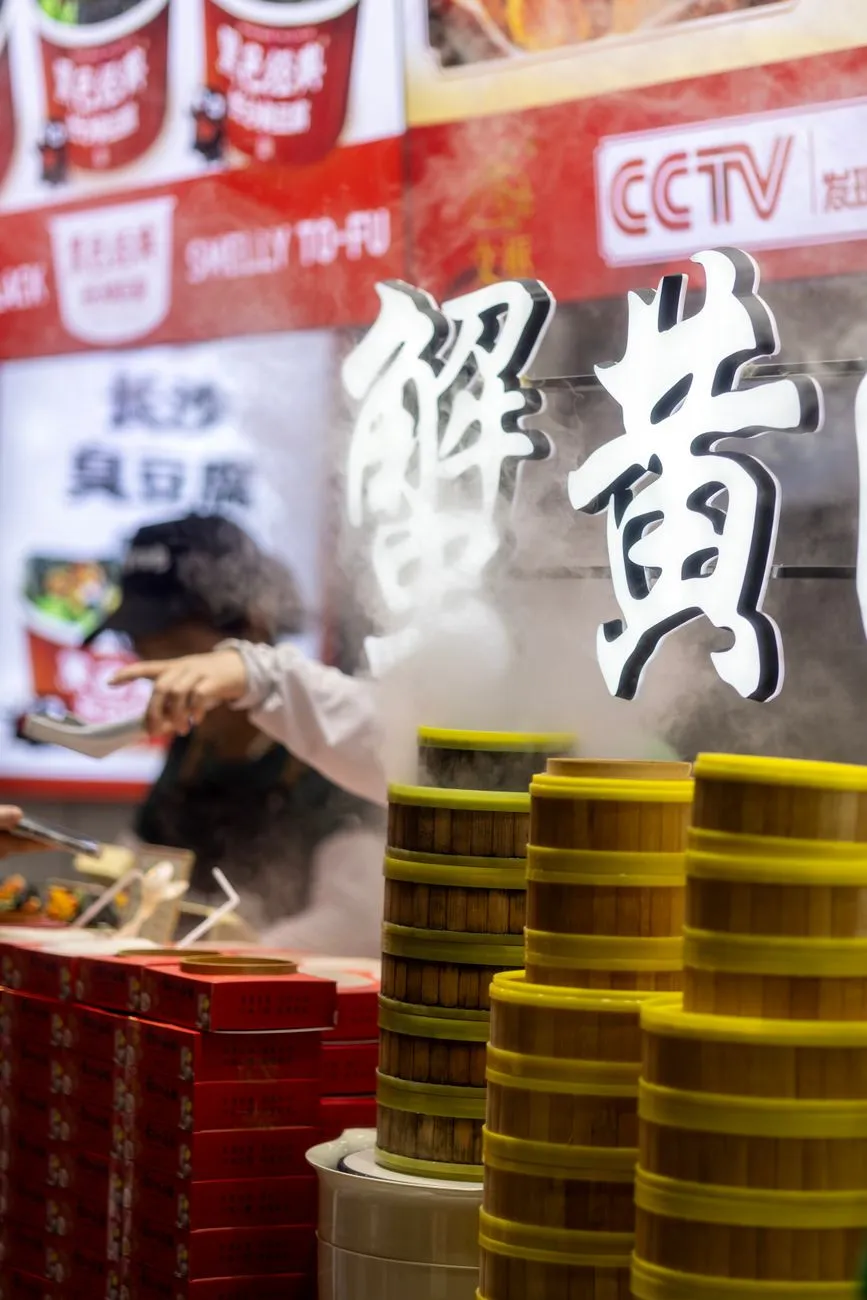 A bustling Hong Kong street market with dim sum stalls