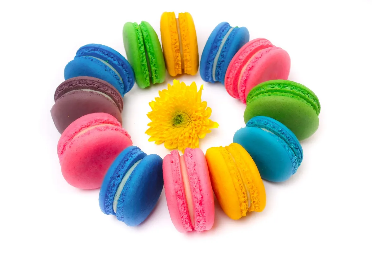 A close-up of colorful macarons arranged in a perfect circle