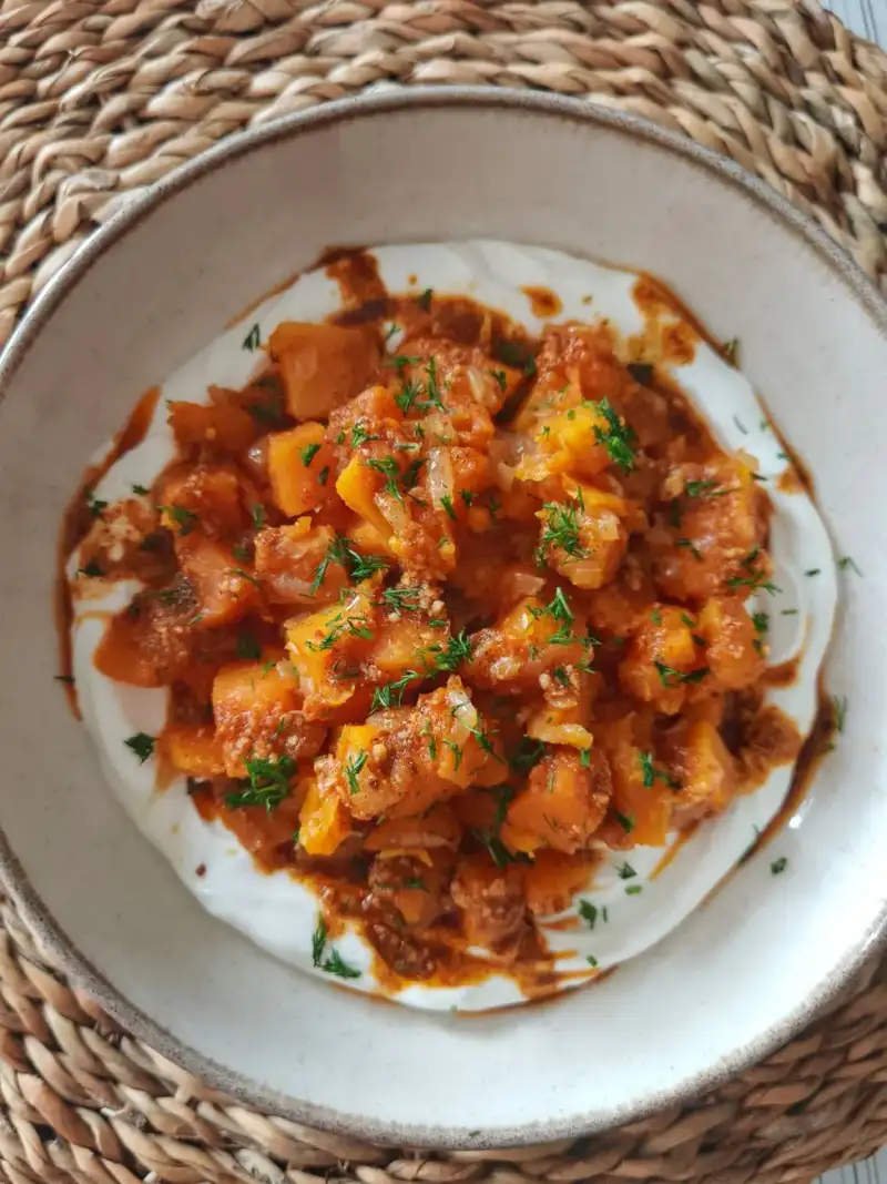 Plating the lentil stew with lemon