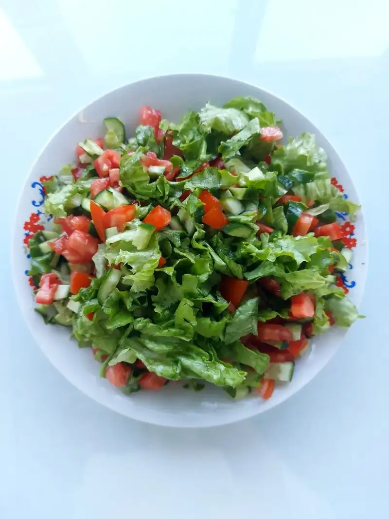 A vibrant, freshly made Turkish Shepherd's Salad with walnuts