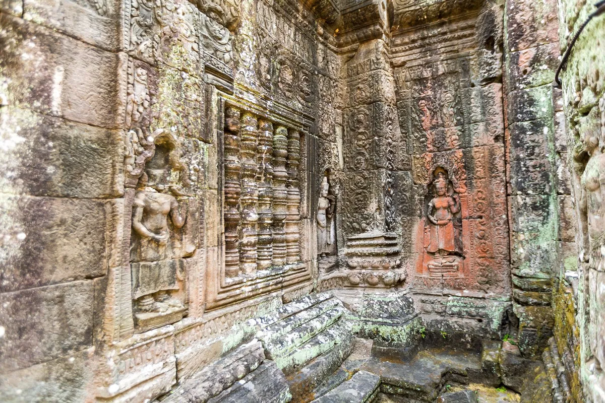 Volunteers cleaning temple ruins at Angkor Wat