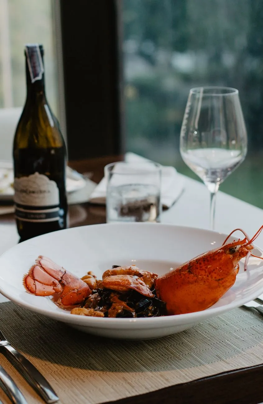 A sophisticated plate presented by a professional chef