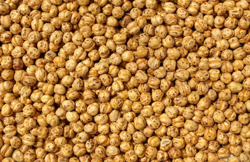 Close-up of freshly cooked chickpeas, glistening and ready to be transformed into creamy hummus.