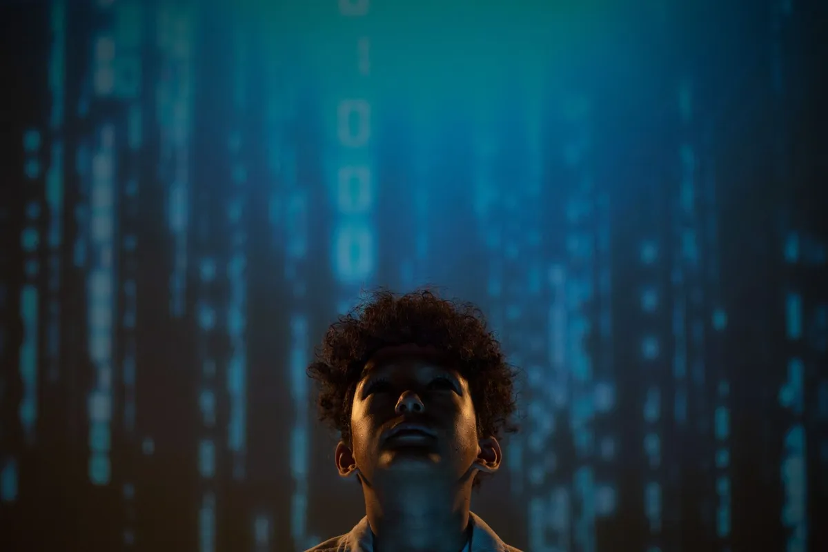 Abstract digital art showing a human figure surrounded by chains of binary code, representing data enslavement