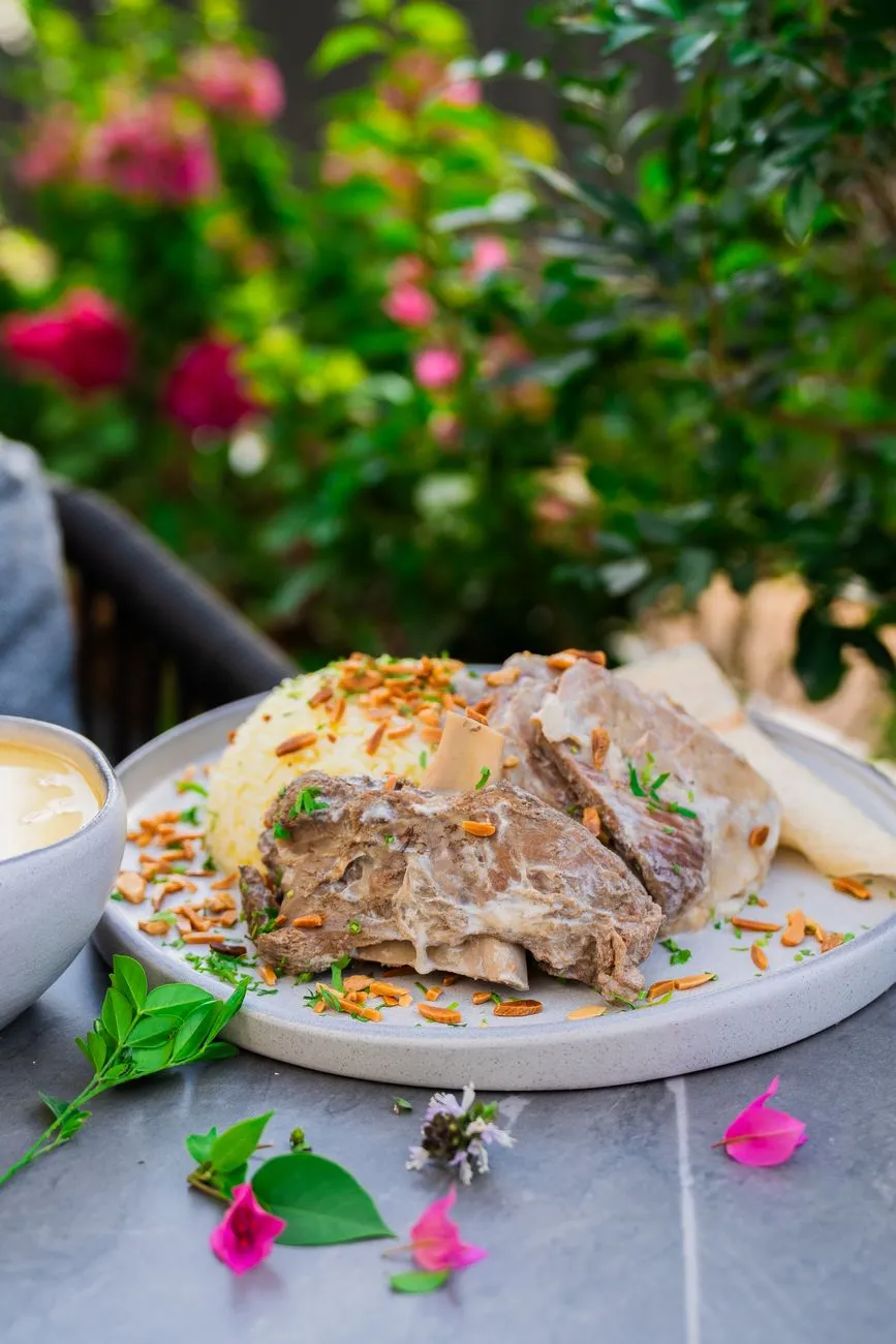 A traditional Jordanian mansaf dish served on a large platter