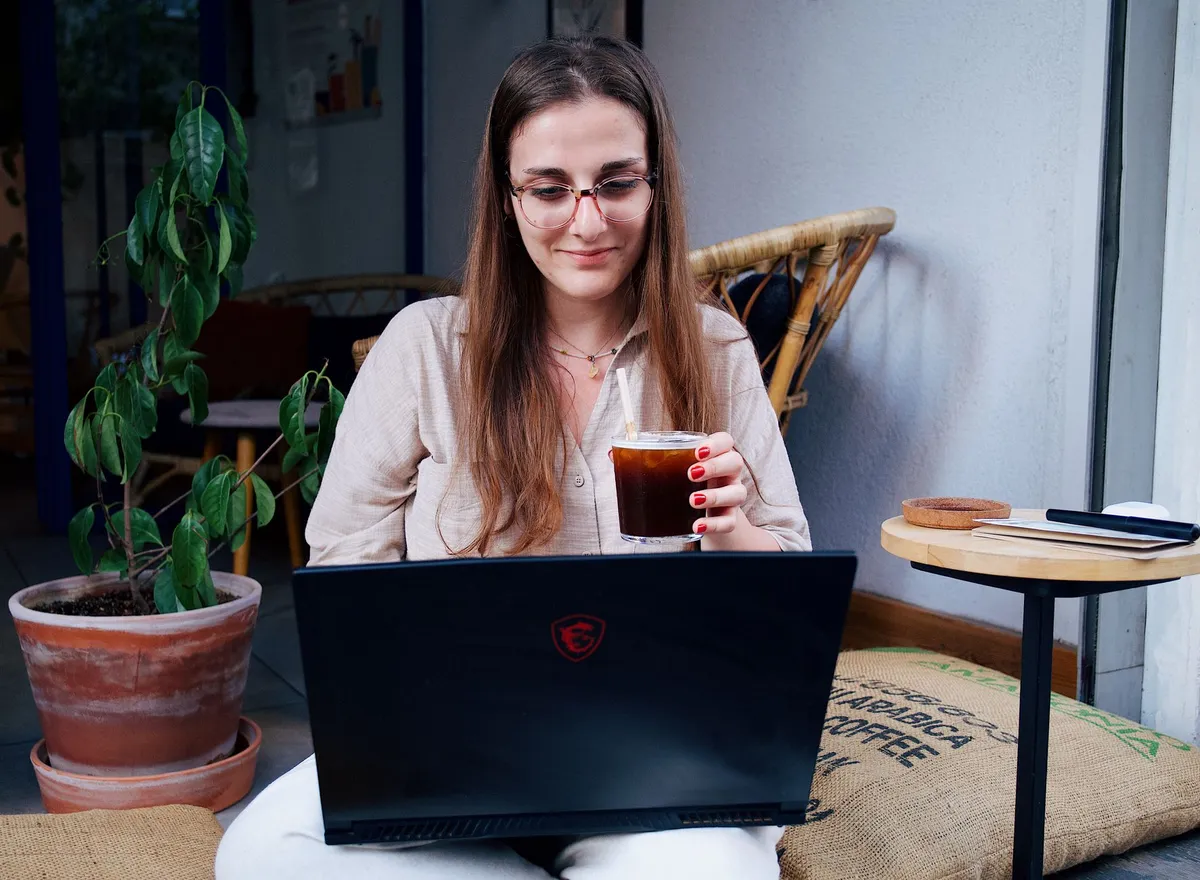 A digital nomad working in a cozy Jordanian café