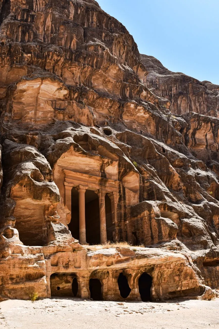 Archaeologists examining ancient artifacts in Petra's excavation site