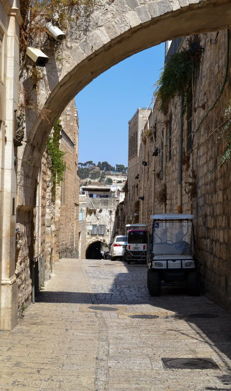 The view of a historic city street from a balcony