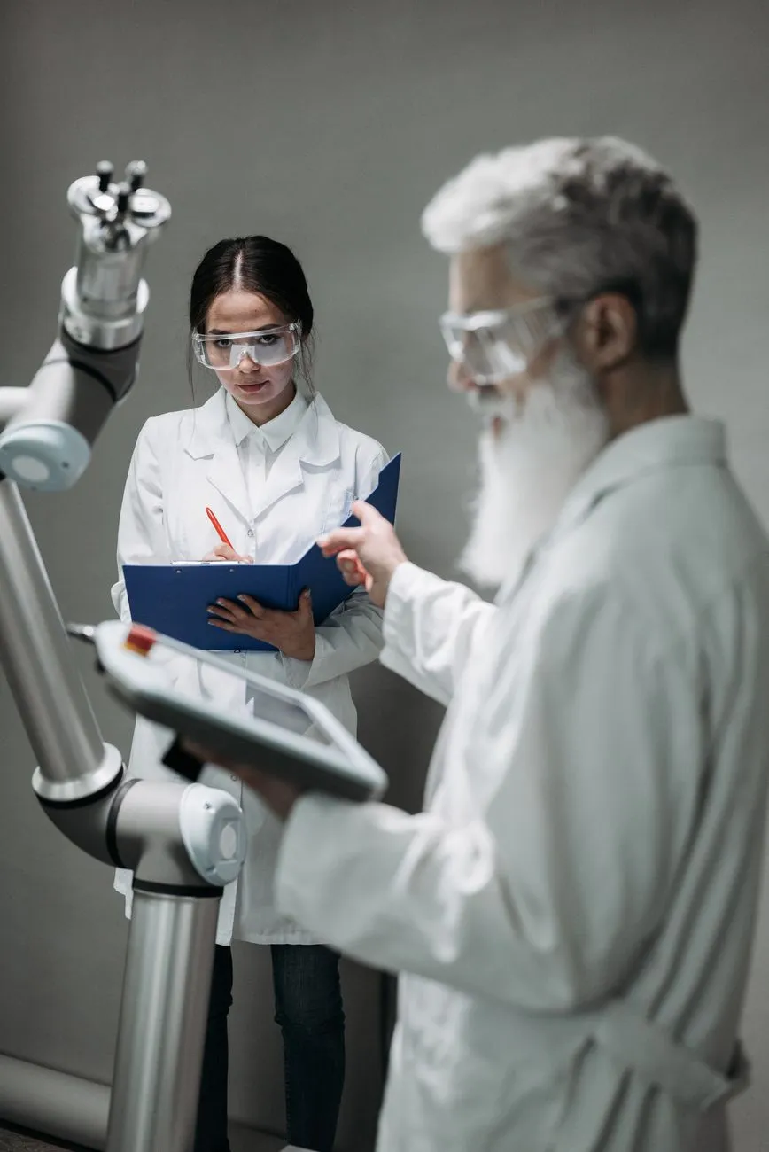 Robotics engineer collaborating with a humanoid robot