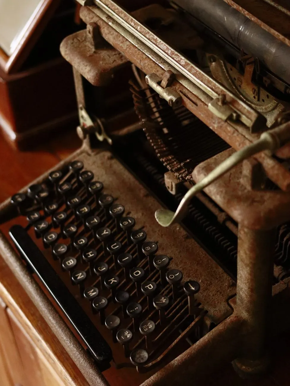 A vintage typewriter on a wooden desk