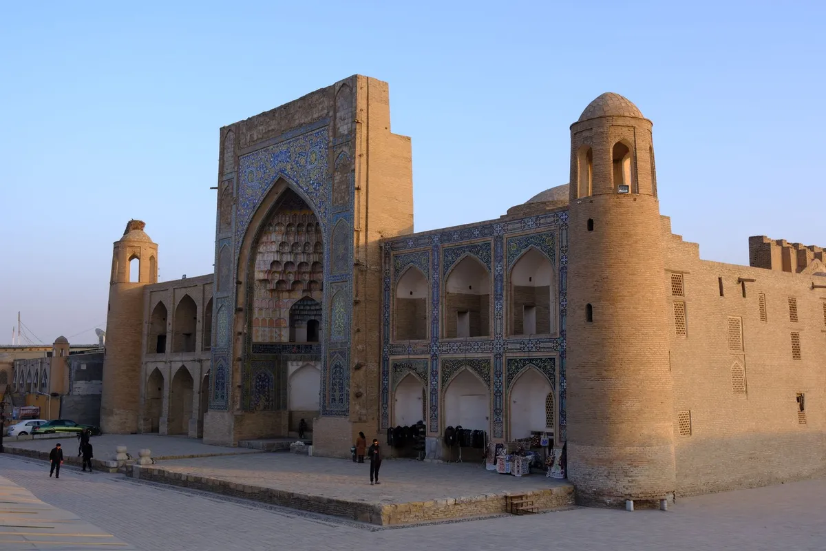 Bukhara caravanserai courtyard with arched walkways
