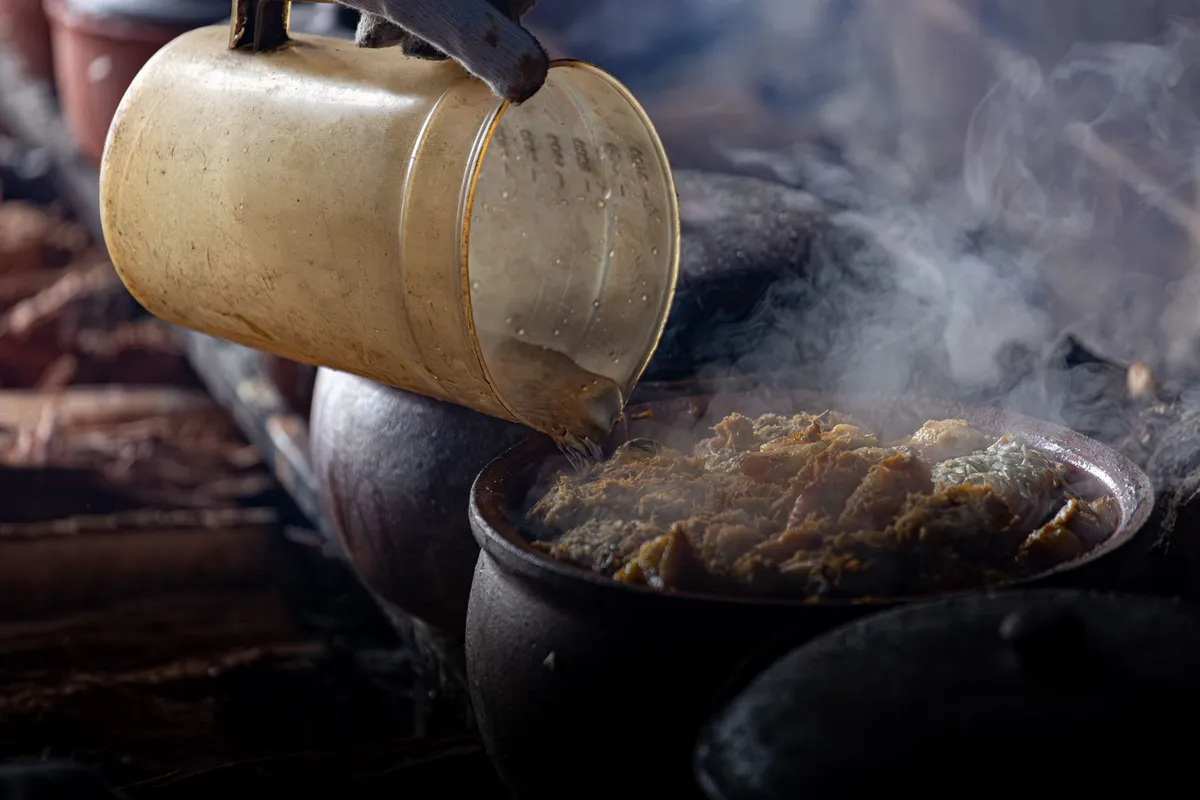 Traditional Uzbek plov being served in a clay pot