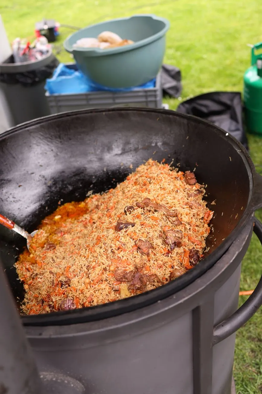 Uzbek plov being served in a traditional kazan