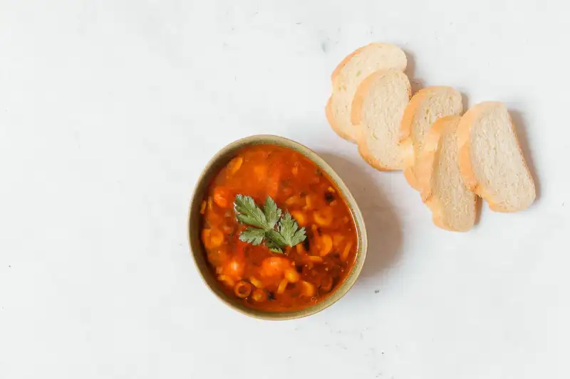 Traditional Italian soup pot on a wooden table