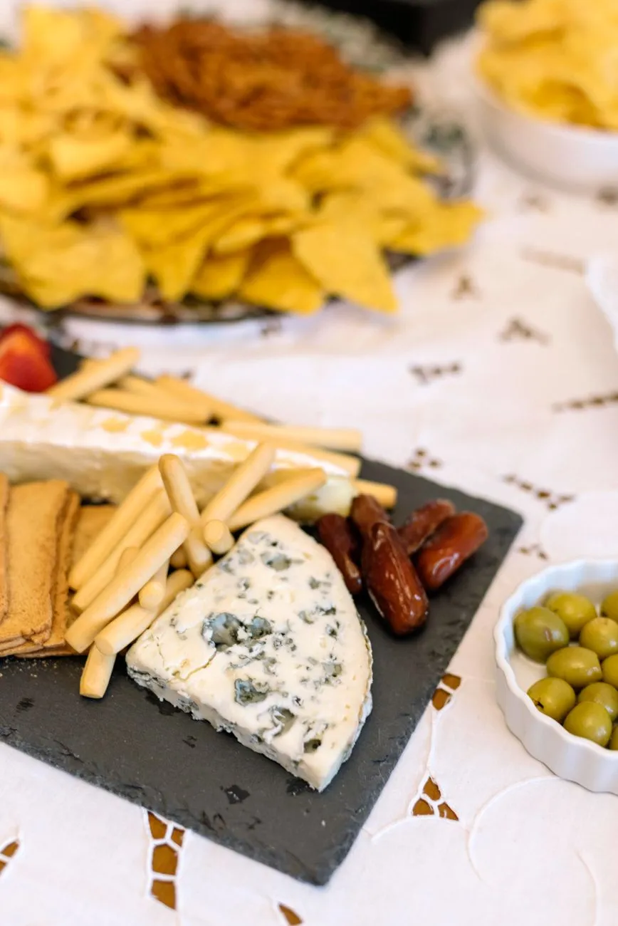 A vibrant spread of Spanish tapas on a rustic wooden table