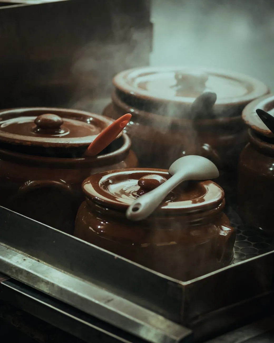 Mole sauce simmering in copper pot