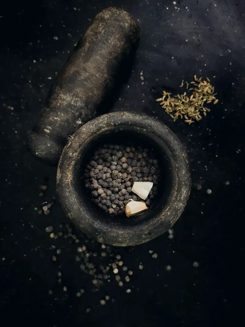 Ancient spices being ground with mortar and pestle