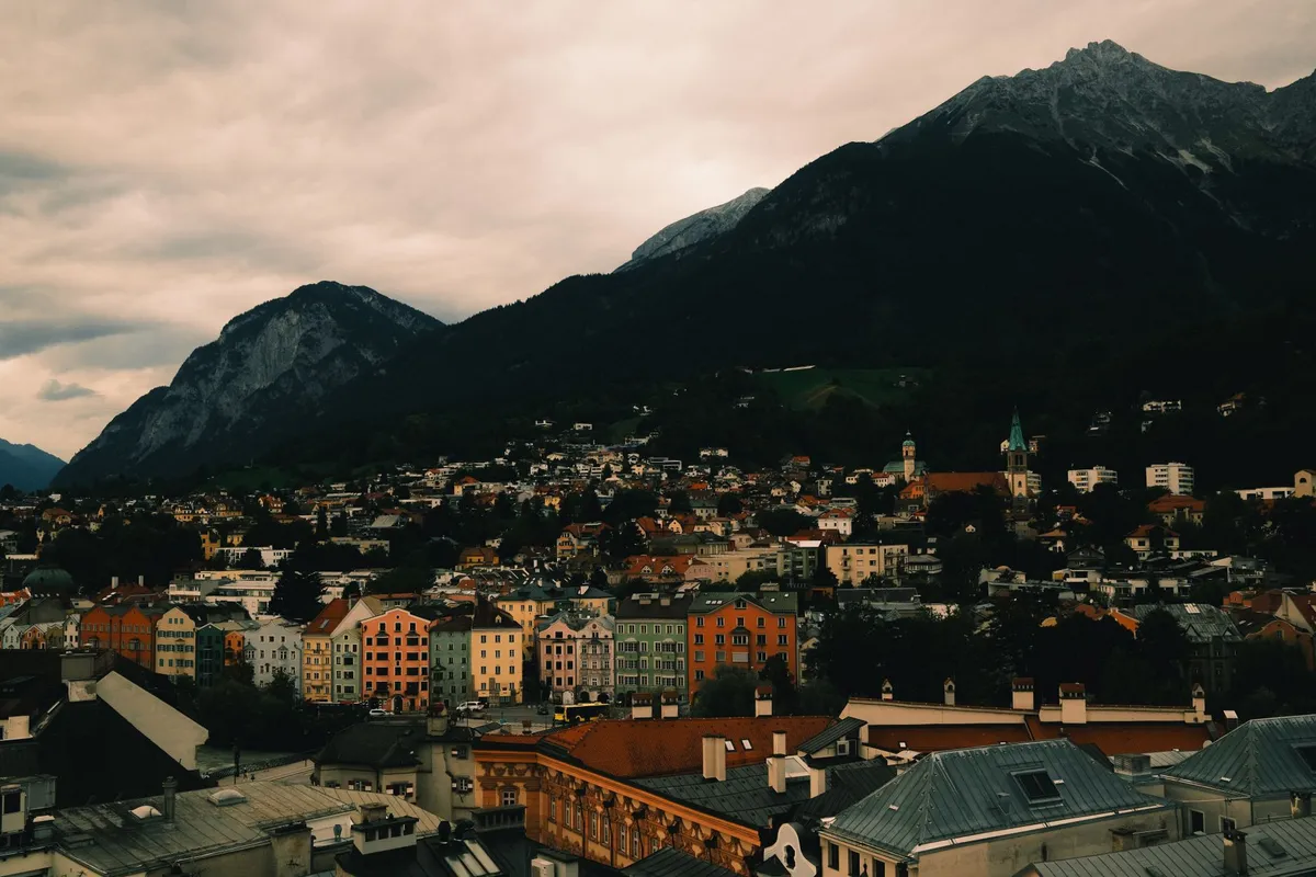 A serene view of an alpine village along the salt path
