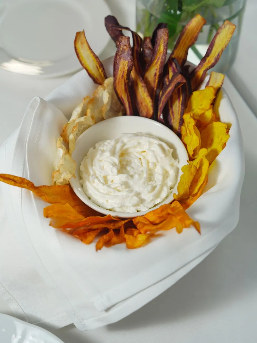 Upcycled vegetable chips on a wooden platter