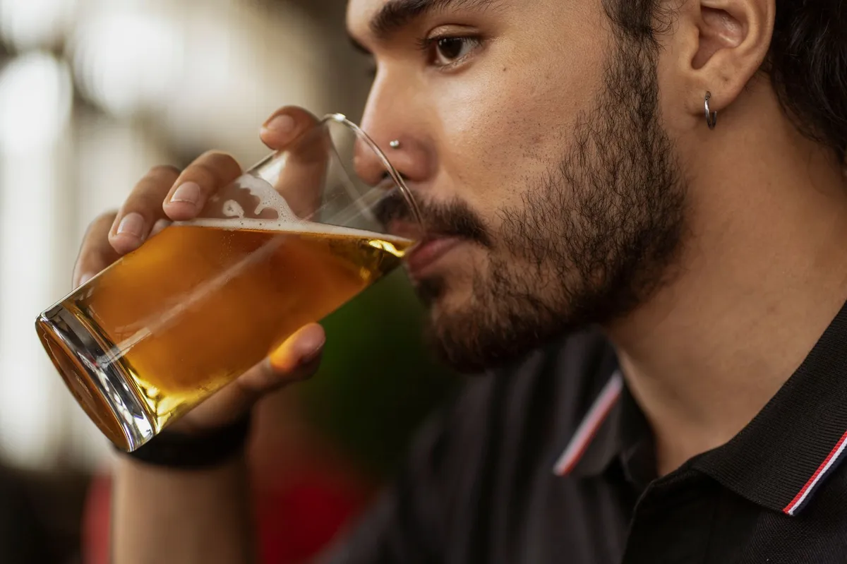 A home brewer sampling their first batch of craft beer