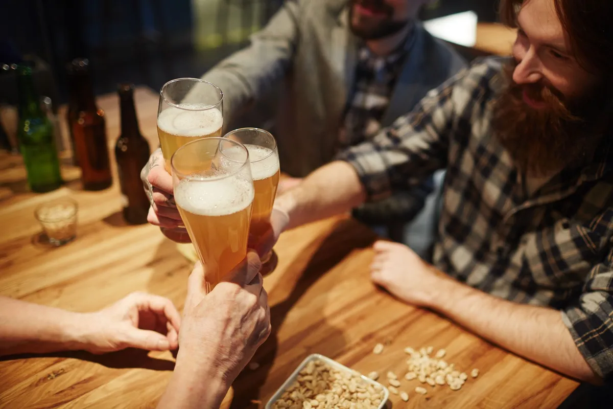 A group of home brewers toasting with their latest creations