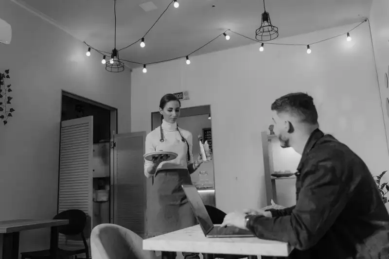 A group of digital nomads working in a cozy café