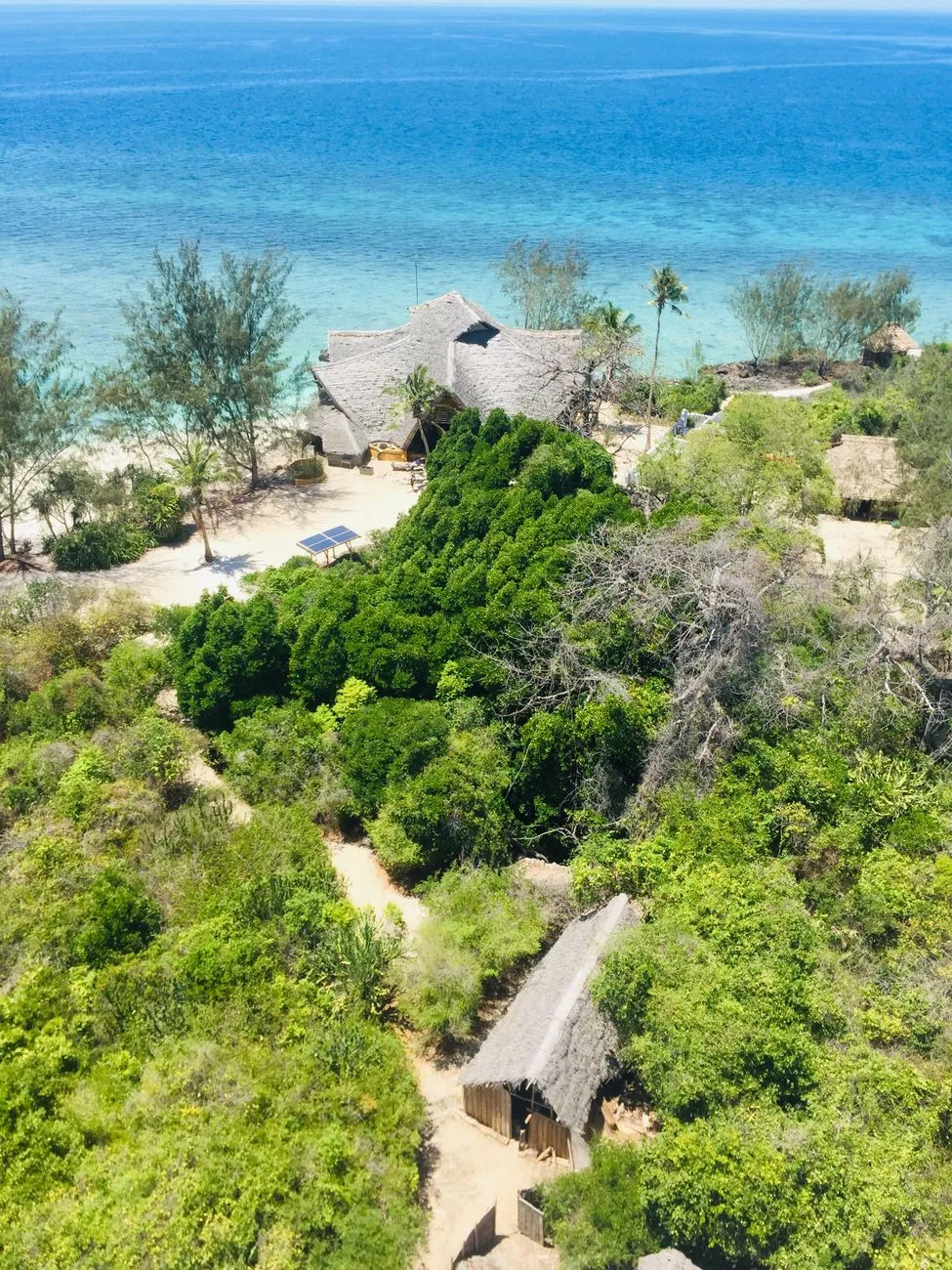 A secluded beach with powdery white sand and crystal-clear turquoise water in Zanzibar