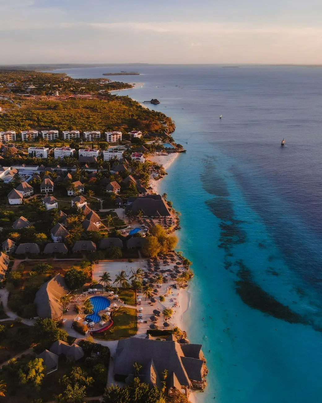 Aerial view of a secluded beach with turquoise water and white sand in Zanzibar